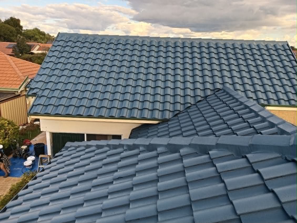 The same tile roof after a full restoration, sealed and recoated