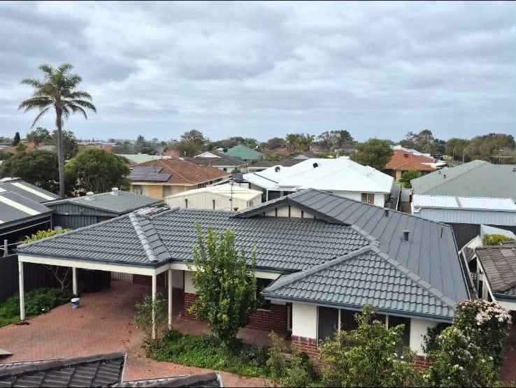 Finished basalt tile roof seen across the whole house