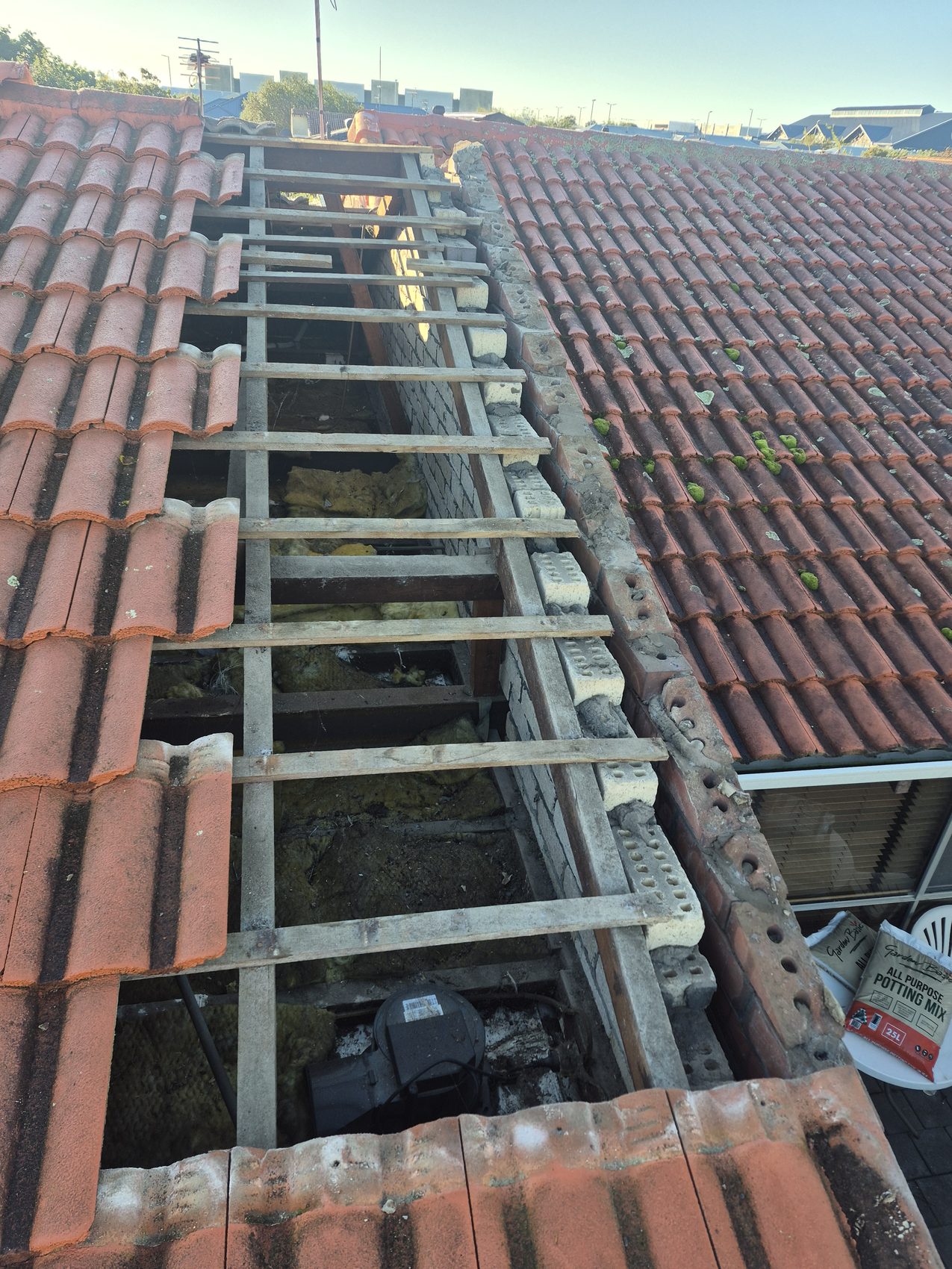 Before: worn tiles and tired pointing