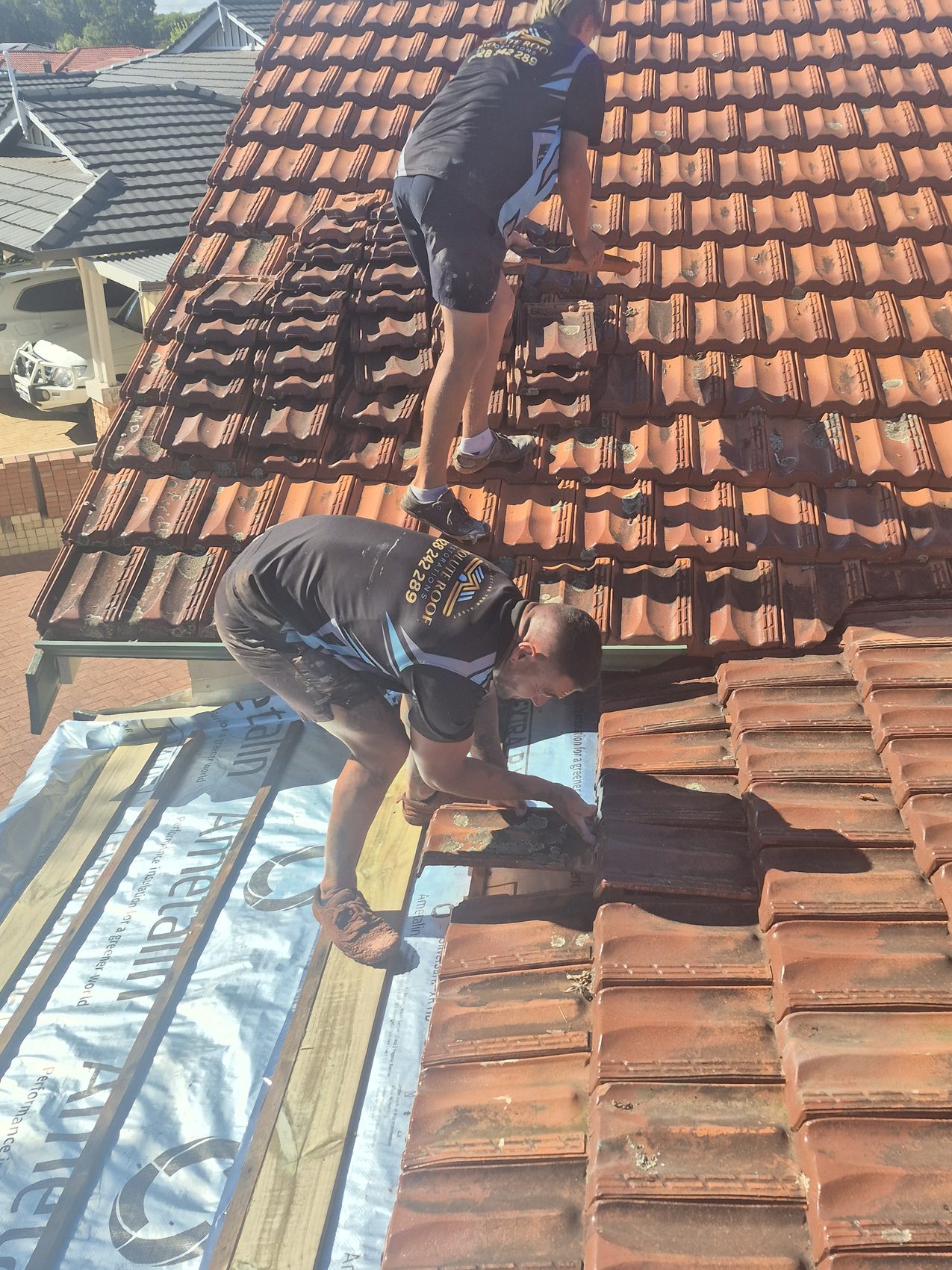 Rebedding and repointing ridge caps by hand