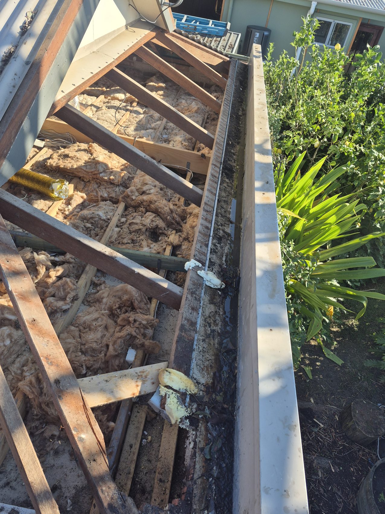 Tiles lifted to expose and repair the roof timbers below