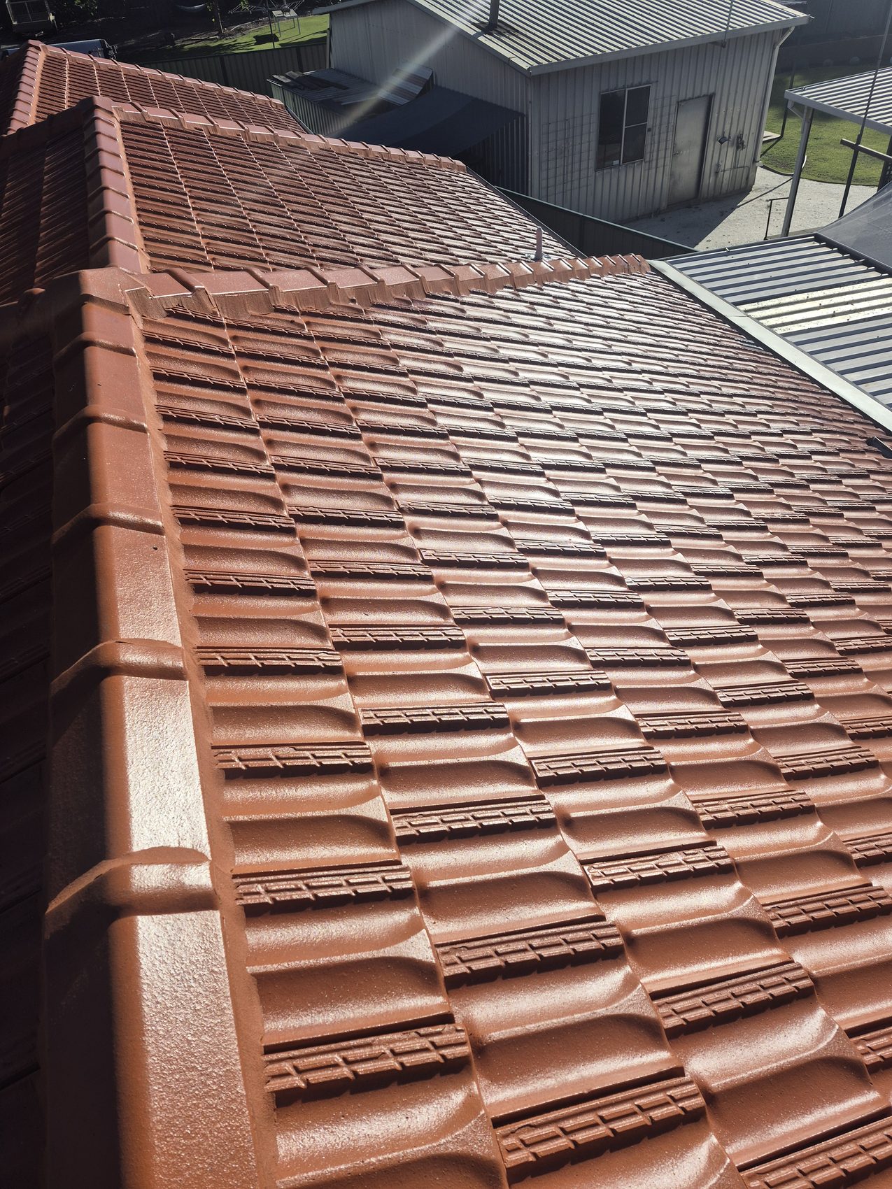 A freshly coated terracotta roof, close up